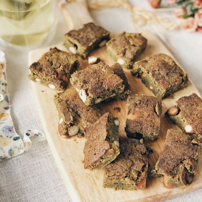 Pandan moringa cookie bars on a wooden board